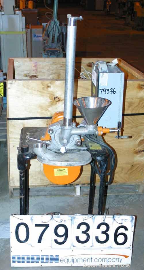 Used Pulvette Pulva-Sizer Hammermill, 304 Stainless Steel. 5" diameter rotor with (6) 1-1/4" wide T style swing hammers. Has gravity feed and a 7/8" diameter manual screw feed. Mill driven by a 1 HP,...