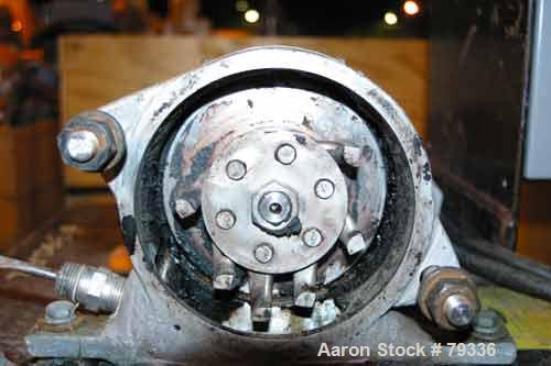 Used Pulvette Pulva-Sizer Hammermill, 304 Stainless Steel. 5" diameter rotor with (6) 1-1/4" wide T style swing hammers. Has gravity feed and a 7/8" diameter manual screw feed. Mill driven by a 1 HP,...