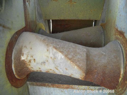 Used Banbury Mixer, Model 00, Carbon Steel. Chrome plated steel rotor, body and ends. Capacity 5 pounds at 1.25 SP gravity, cored rotors and bowl. Flat style floating weight. Side open swing doors (2...