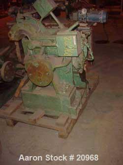 Used Banbury Mixer, Model 00, Carbon Steel. Chrome plated steel rotor, body and ends. Capacity 5 pounds at 1.25 SP gravity, cored rotors and bowl. Flat style floating weight. Side open swing doors (2...