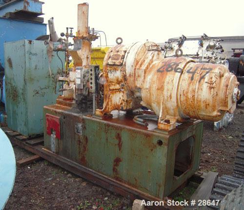 Used Farrel-Birmingham Banbury Mixer,  Model B, Carbon Steel. 2.6 pound capacity, side open design. Air operated feed ram with flat style floating weight. Two wing rotor. 4 speed drive. Driven by a 2...