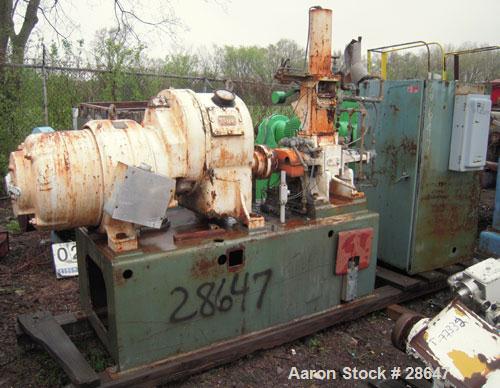 Used Farrel-Birmingham Banbury Mixer,  Model B, Carbon Steel. 2.6 pound capacity, side open design. Air operated feed ram with flat style floating weight. Two wing rotor. 4 speed drive. Driven by a 2...
