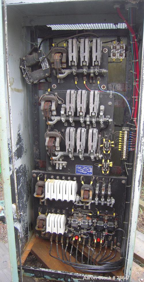 Used Farrel-Birmingham Banbury Mixer,  Model B, Carbon Steel. 2.6 pound capacity, side open design. Air operated feed ram with flat style floating weight. Two wing rotor. 4 speed drive. Driven by a 2...