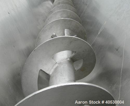 Used Continuous screw mixer, 316 stainless steel. 9" diameter x 105" long x 4 1/2" centers open screw, 2 3/4" diameter shaft. Non-jacketed U-trough 23 1/2" wide x 10' long x 16" deep. 8" end bottom o...