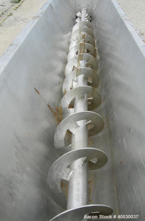 Used Continuous Screw/Paddle Mixer, 316 stainless steel. 9" diameter x 96" long x 4 1/2" centers open screw, 18" long 1/4" thick bolt on paddle section, 2 3/4" diameter shaft. Non-jacketed U-trough 2...
