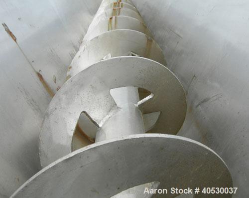Used Continuous Screw/Paddle Mixer, 316 stainless steel. 9" diameter x 96" long x 4 1/2" centers open screw, 18" long 1/4" thick bolt on paddle section, 2 3/4" diameter shaft. Non-jacketed U-trough 2...