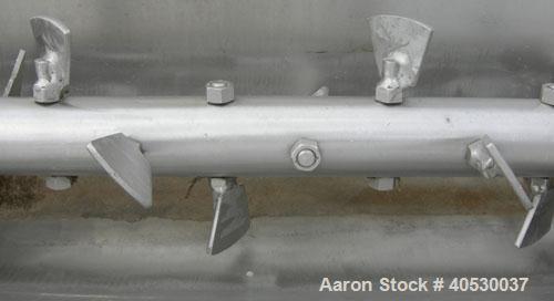 Used Continuous Screw/Paddle Mixer, 316 stainless steel. 9" diameter x 96" long x 4 1/2" centers open screw, 18" long 1/4" thick bolt on paddle section, 2 3/4" diameter shaft. Non-jacketed U-trough 2...