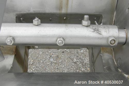 Used Continuous Screw/Paddle Mixer, 316 stainless steel. 9" diameter x 96" long x 4 1/2" centers open screw, 18" long 1/4" thick bolt on paddle section, 2 3/4" diameter shaft. Non-jacketed U-trough 2...