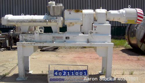Used Teledyne Readco 7 7/8" Twin Shaft Screw Processor, 304 stainless steel. (2) 7 7/8" diameter x approximate 60" long shafts. Carbon steel jacketed clamshell design, barrel rated 150 psi at 450 deg...