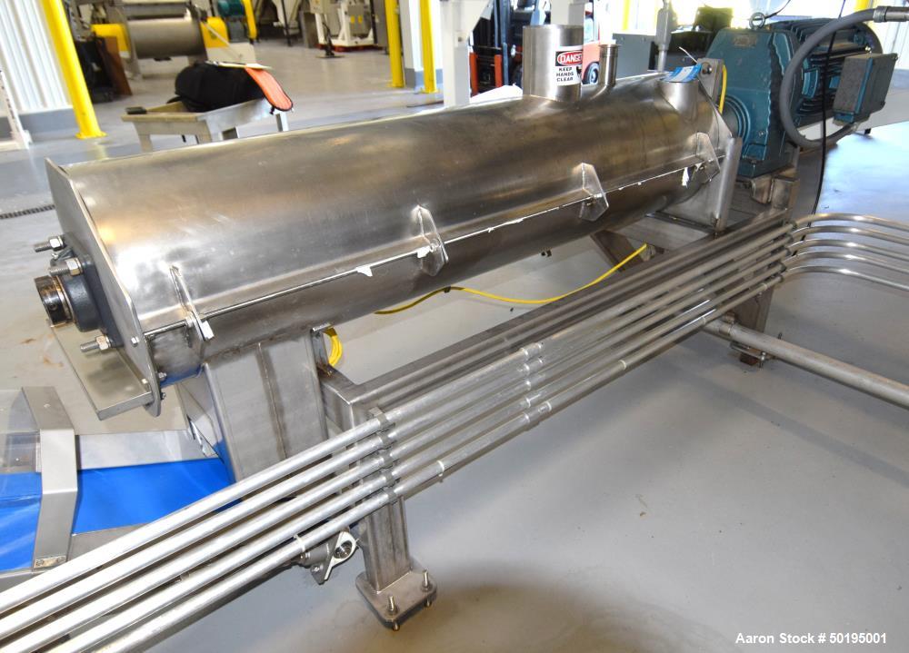 Used GEM Equipment Continuous Mixer, Stainless Steel. Clamshell non-jacketed chamber approximate 16" diameter x 65" long. Single shaft with approximate 2-1/2" wide x 3/8" thick paddles. Top end feed,...