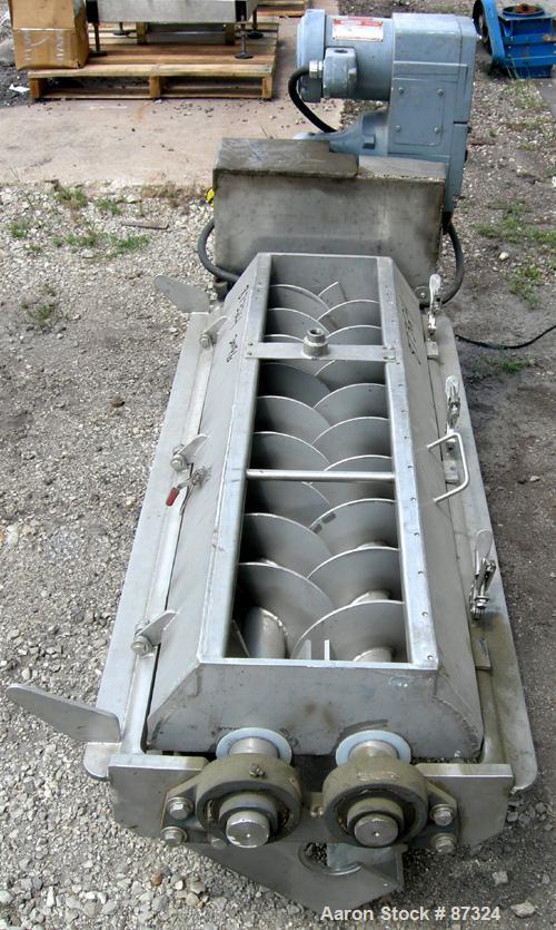 Used Dual Shaft Continuous Screw Blender, 304 Stainless Steel. (2) 8" Diameter x 44" long screws. Clamshell design non-jacketed trough. Top end feed, end bottom discharge. Driven by a 1 HP, 3/60/230/...