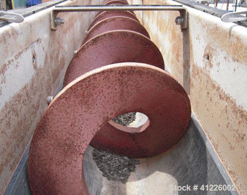 Used Continuous "L" Shaped Mixer consisting of: (1) Horizontal section with an 11" diameter x 5" pitch single ribbon, 4130 carbon steel, 304 stainless steel trough, partially rubber lined, 12 1/2" wi...