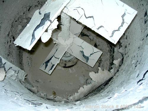 Used Used: Kady Mill, model 5C, stainless steel. Approximately 300 gallon capacity. 42" diameter x 68" deep jacketed tank. 8" diameter bottom blade, driven by a 100 hp motor. (2) side wall baffles, t...