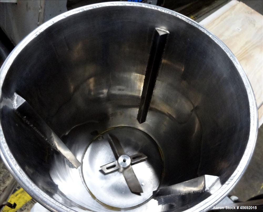 Used Fabricated Stainless Steel Mixing System, Approximately 25 gallons, Stainless Steel. 17-1/2" diameter x 25" straight side. (4) blade bottom mixer. Driven by 1.5Kw, 1725 rpm, 3/60/208-230/460 vol...