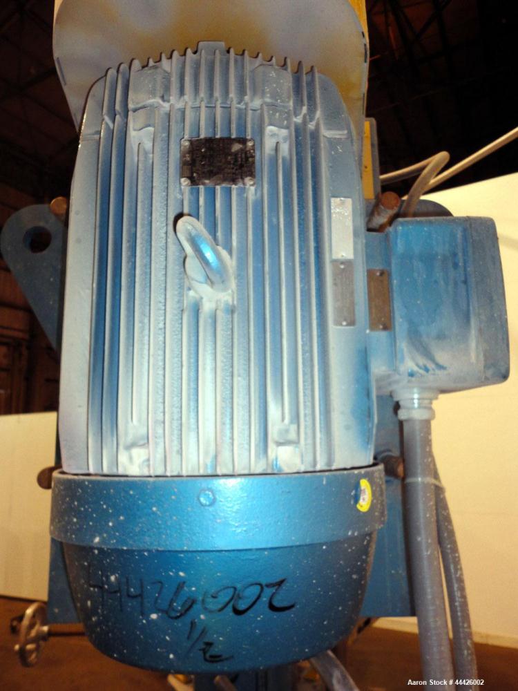 Used Bowers Disperser. 2-1/2” Diameter approximate 53” long 316 stainless steel shaft with a 304 stainless steel 18'' diameter saw tooth blade. Air/oil lift, adjustable tank holder. Driven by a 50hp,...