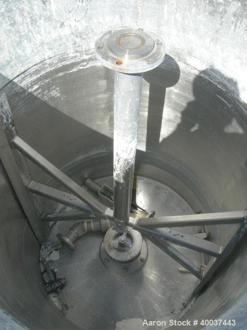 Used Kady Mill, Model 5C, 304 Stainless Steel. Approximately 300 gallon capacity. 42" diameter x 68" deep tank. 8" diameter bottom blade, driven by a 125 hp motor. Top entering agitator with sweep bl...