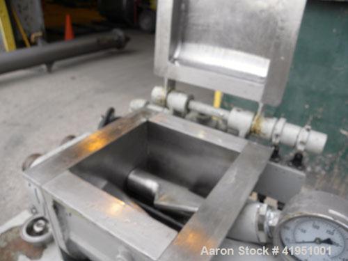 Used AMK Double Arm Mixtruder, approximately 1-1/2 gallon working capacity, 316 stainless steel. Carbon steel jacketed bowl, 7-7/8" left to right x 9" front to back x approximately 5" deep. Hinged to...