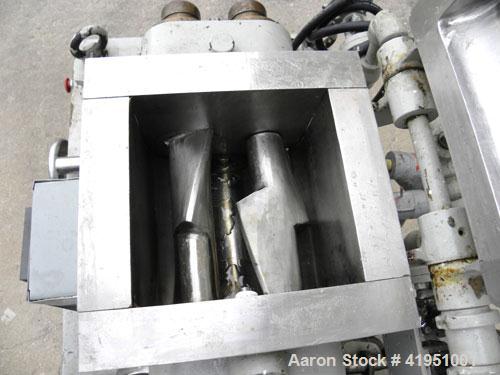 Used AMK Double Arm Mixtruder, approximately 1-1/2 gallon working capacity, 316 stainless steel. Carbon steel jacketed bowl, 7-7/8" left to right x 9" front to back x approximately 5" deep. Hinged to...
