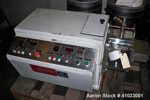 Used Jaygo Baker Perkins Model AME-7 Double Arm Sigma Mixer Extruder. Manufactured 1997. Unit features approximately 2 gallon working capacity, 7 1/2" long x 7" wide x 7" deep mix trough, stainless s...
