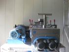 Used LCI Continuous Kneader, model CKDJS-10. 304 stainless steel product contact parts, balance in painted carbon steel, 10 liter working volume, adjustable discharge weir, clamped lids with limit sw...