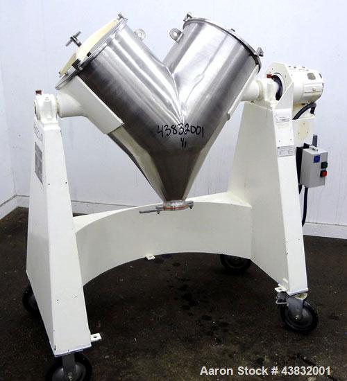 Used Apex Construction Limited Twin Shell Blender, approximately 4 cubic feet capacity, 321 stainless steel. (2) 15" diameter charge ports with quick release covers. Shell driven by a 1/2 hp, 3/60/38...