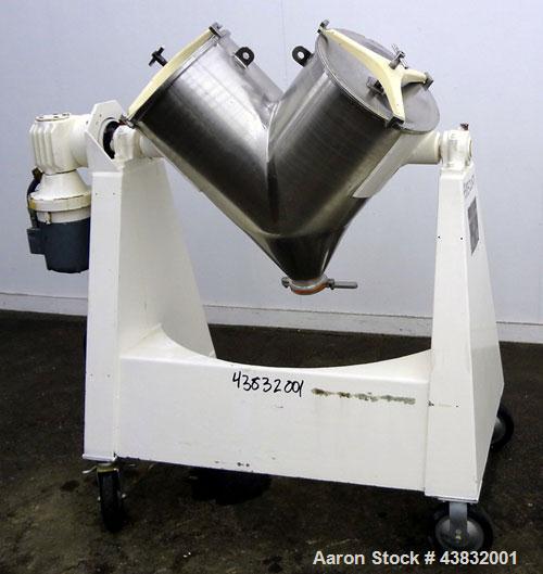 Used Apex Construction Limited Twin Shell Blender, approximately 4 cubic feet capacity, 321 stainless steel. (2) 15" diameter charge ports with quick release covers. Shell driven by a 1/2 hp, 3/60/38...