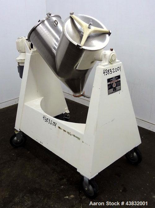 Used Apex Construction Limited Twin Shell Blender, approximately 4 cubic feet capacity, 321 stainless steel. (2) 15" diameter charge ports with quick release covers. Shell driven by a 1/2 hp, 3/60/38...