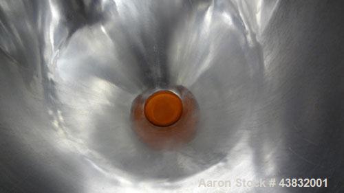 Used Apex Construction Limited Twin Shell Blender, approximately 4 cubic feet capacity, 321 stainless steel. (2) 15" diameter charge ports with quick release covers. Shell driven by a 1/2 hp, 3/60/38...