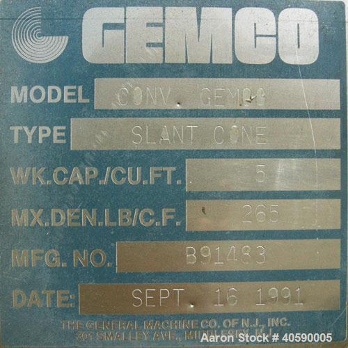 Used Gemco Slant Cone Blender, 5 cubic feet working capacity, 316 stainless steel. Maximum material density 265 pounds per cubic foot. Approximately 31 1/2'' diameter x 10'' and 17'' cones. 16'' char...