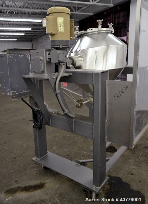 Used Gemco Slant Cone Blender, 5 Cubic Feet Working Capacity, 316 Stainless Steel. Approximately 31-1/2” diameter x 16” and 10” cones.  16” Diameter charge port with cover, 6” center bottom outlet wi...