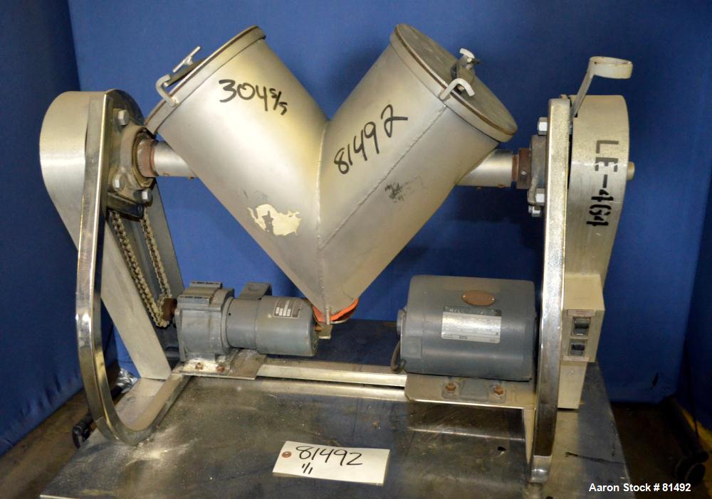 Used Patterson-Kelley Twin Shell Liquid-Solids Blender, 0.26 Cubic Feet Capacity (8 Quart), 304 Stainless Steel. (2) 7-1/2" Diameter x 15" deep shells with quick release top covers. Shell driven by a...