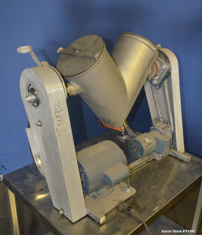 Used Patterson-Kelley Twin Shell Liquid-Solids Blender, 0.26 Cubic Feet Capacity (8 Quart), 304 Stainless Steel. (2) 7-1/2" Diameter x 15" deep shells with quick release top covers. Shell driven by a...