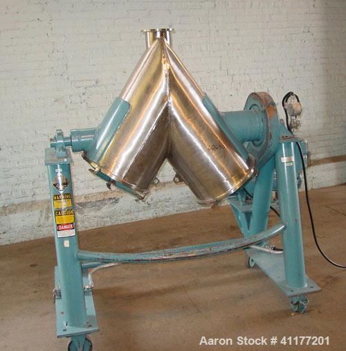 Used Patterson Kelly Twin Shell Cross Flow Blender, 5 cubic feet capacity, 304 stainless steel. Maximum material density 70 pounds per cubic foot. (2) 20" diameter charge ports with quick release cov...