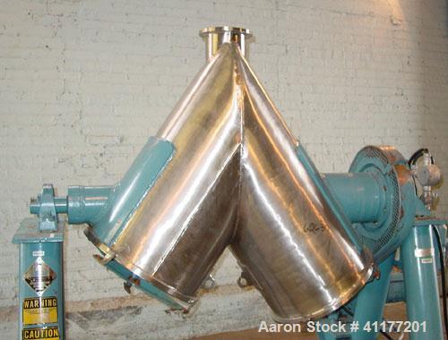 Used Patterson Kelly Twin Shell Cross Flow Blender, 5 cubic feet capacity, 304 stainless steel. Maximum material density 70 pounds per cubic foot. (2) 20" diameter charge ports with quick release cov...