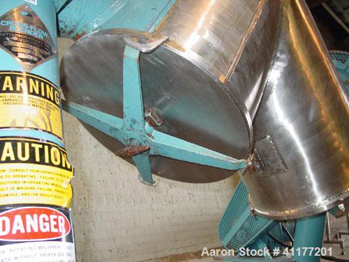 Used Patterson Kelly Twin Shell Cross Flow Blender, 5 cubic feet capacity, 304 stainless steel. Maximum material density 70 pounds per cubic foot. (2) 20" diameter charge ports with quick release cov...
