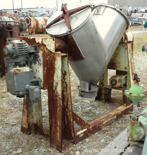 Used Patterson Kelley Twin Shell Dry Blender, 5 Cubic Feet, 304 Stainless Steel. Maximum material density 65 pounds per cubic foot. (2) 18" Diameter openings with quick release covers missing clamps....
