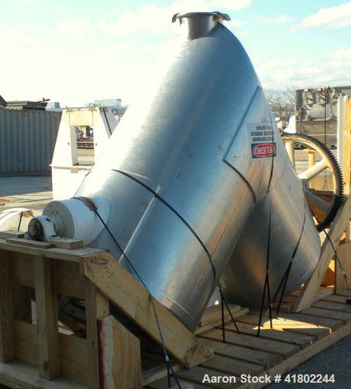 Used Patterson Kelley Twin Shell Dry Blender, 60 Cubic Feet Capacity, 304 Stainless Steel. Maximum material density 50 pounds per cubic foot. 18" diameter charge ports with quick release covers. Shel...