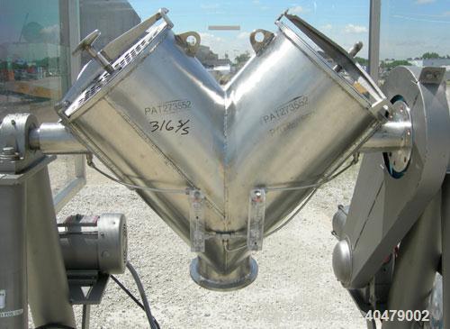 Used Patterson Kelley twin shell dry blender, 2 cubic foot capacity, 316 stainless steel. Max material density 85 pounds per cubic foot. 14" diameter cones with quick release covers. Shell driven by ...