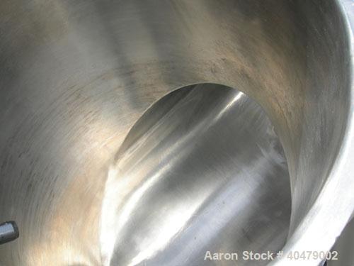 Used Patterson Kelley twin shell dry blender, 2 cubic foot capacity, 316 stainless steel. Max material density 85 pounds per cubic foot. 14" diameter cones with quick release covers. Shell driven by ...