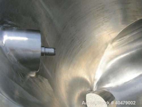 Used Patterson Kelley twin shell dry blender, 2 cubic foot capacity, 316 stainless steel. Max material density 85 pounds per cubic foot. 14" diameter cones with quick release covers. Shell driven by ...