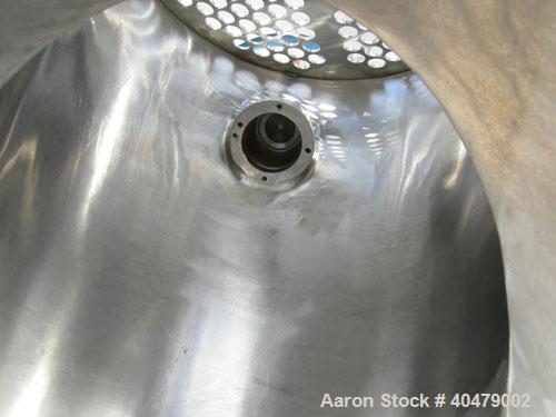 Used Patterson Kelley twin shell dry blender, 2 cubic foot capacity, 316 stainless steel. Max material density 85 pounds per cubic foot. 14" diameter cones with quick release covers. Shell driven by ...