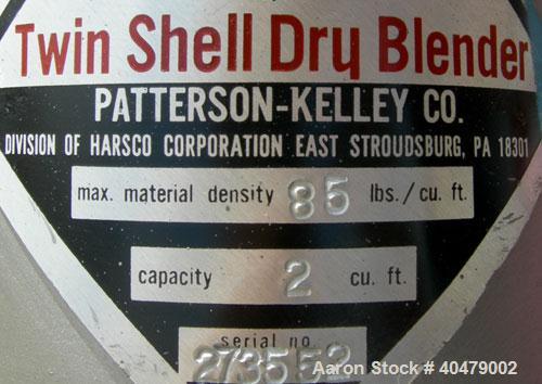 Used Patterson Kelley twin shell dry blender, 2 cubic foot capacity, 316 stainless steel. Max material density 85 pounds per cubic foot. 14" diameter cones with quick release covers. Shell driven by ...