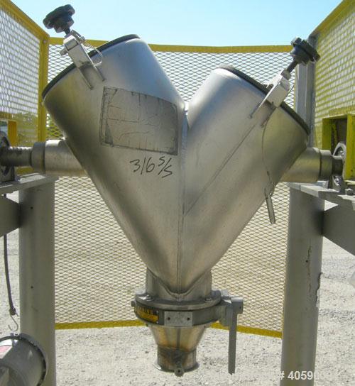 Used Patterson Kelly twin shell cross flow blender, 1 cubic foot capacity, 316 stainless steel. Maximum material density 500 pounds per cubic foot. (2) 10" diameter charge ports with quick release co...