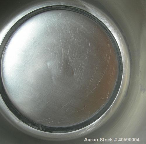 Used Patterson Kelly twin shell cross flow blender, 1 cubic foot capacity, 316 stainless steel. Maximum material density 500 pounds per cubic foot. (2) 10" diameter charge ports with quick release co...