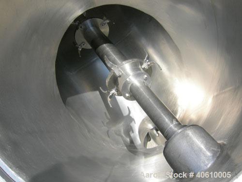 Used Patterson Kelley Twin Shell Liquid Solids Blender, 3 cubic feet capacity, 304 stainless steel. 60 pounds per cubic foot max material density. Liquid solids bar, driven by a 2 hp, 3/60/230/460 vo...