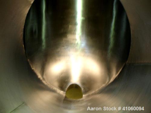 Used Patterson Kelley Twin Shell Crossflow Blender, 50 cubic feet, stainless steel construction. Rated 65 pounds per cubic foot maximum material density. Standard feed ports with covers, 10 outlet wi...