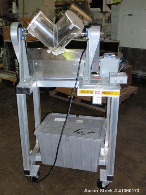 Used Patterson Kelley Twin Shell Blender, 150#/ cubic foot max material density, with (1) 8 quart and (1) 4 quart plastic shell, bench top design with motor. Serial #LB10768.