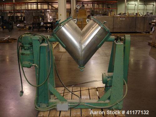 Used Patterson-Kelley Twin Shell Dry Blender, 2 Cubic Feet Capacity, Stainless Steel. Maximum material density 195 pounds per cubic foot. 14" diameter cones with quick release covers. Shell driven by...