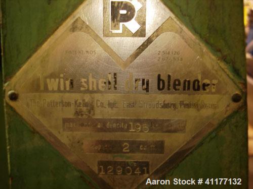 Used Patterson-Kelley Twin Shell Dry Blender, 2 Cubic Feet Capacity, Stainless Steel. Maximum material density 195 pounds per cubic foot. 14" diameter cones with quick release covers. Shell driven by...
