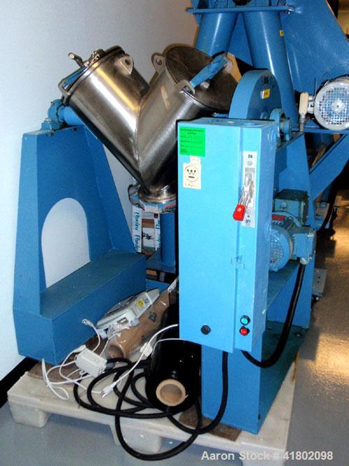 Used Patterson Kelly Twin Shell Blender, 1 cubic foot capacity, stainless steel. Maximum material density 500 pounds per cubic foot. (2) 10" diameter charge ports with quick release covers. Shell dri...